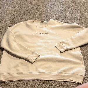 “Saved by Grace” Cream Graphic Crewneck Sweater